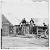 Soldier chopping wood in camp