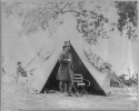 Ambrose Everett Burnside, 1824-1881, Major General, full-length portrait, standing in front of tent, arm bent with hand in coat, facing right