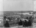 Encampment of Army of Potomac at Cumberland Landing on Pamunkey River; 5 Union soldiers seated on hill in foregrd.