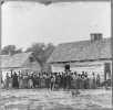 Large group of slaves(?) standing in front of buildings on Smith's Plantation, Beaufort, South Carolina