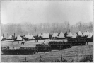 Civil War camp scene. Bird's-eye view of troops in formation and tents in backgrd.