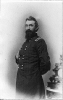 N. Kimball, three-quarter length portrait, standing, facing left; with right hand inside his coat and left hand behind himself