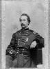 Frank Wheaton, three-quarter length portrait, seated, facing left, in uniform