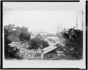 View of City Point, Virginia, with covered wagons moving toward pier and harbor in background