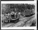 Soldiers with cannon on small railroad car