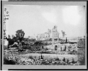 Ruins at Hampton, Virginia showing chimneys, and man standing