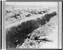 Dead Confederate soldier in trench at Fort Mahone, Petersburg, Va., April 3, 1865