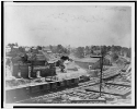 View of Atlanta, Georgia, with railroad cars in left foreground