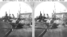 Washington Navy Yard, District of Columbia 
 
    View on board ships moored off the yard's western waterfront
    in 1865-66. Ships in the immediate foreground are monitors. The
    odd 