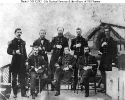 CSS Sumter (1861-1862) 
 
    Ship's officers on deck. 
    They are Seated, left to right: 
    First Lieutenant William E. Evans; 
    Commander Raphael Semmes, Commanding Officer; and 
    First Assistant Engineer Miles J. Freem
