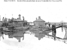 USS Montauk (1862-1904) - at left, and 
    USS Lehigh (1863-1904) - at right 
 
    Laid up at the Philadelphia Navy Yard, Pennsylvania, circa late
    1902 or early 1903. 
    Other ships present, at extreme left and in cen