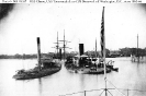 Ships moored off the Washington Navy Yard, D.C. 
 
    Photographed from the stern of USS Minatanomoh, circa
    1865-66. 
    Ships in the foreground are the monitors Chimo and Tonawanda.
    Beyond them is the ex-CSS Sto