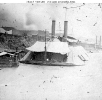 USS Essex (1861-1865) 
 
    Moored at Memphis, Tennessee, with her awnings up, during the
    Civil War. 
    Note mortar boats alongside Essex, also with awnings deployed,
    and small building atop the bluff, toward the left, ma