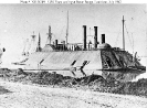 USS Essex (1861-1865) 
 
    Coaling at Baton Rouge, Louisiana, in late July 1862, just after
    she reached the lower Mississippi. Ships of Farragut's fleet
    are in the background. 
 
    The original photograph accompanied a claim f