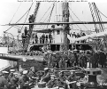 USS Mendota (1864-1867) 
 
    Ship's officers and crew on the foredeck, 1864-65. Photographed
    by Matthew Brady. 
    Note 100-pounder Parrott rifled gun on a pivot carriage; men
    wearing white 