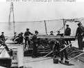 IX-inch Dahlgren Smooth-bore Gun, 
    on a slide-pivot mounting 
 
    With its crew at their stations, on board a U.S. Navy gunboat
    during the Civil War. Photographed by Matthew Brady. 
    Note anti-boarding netting; ship's wheel at left;