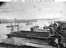 Mare Island Navy Yard, California 
 
    View looking along the waterfront during the 1870s, with the
    city of Vallejo on the opposite side of the channel. 
    Ships tied up at the Navy Yard include USS Saranac (left),
    USS Indep